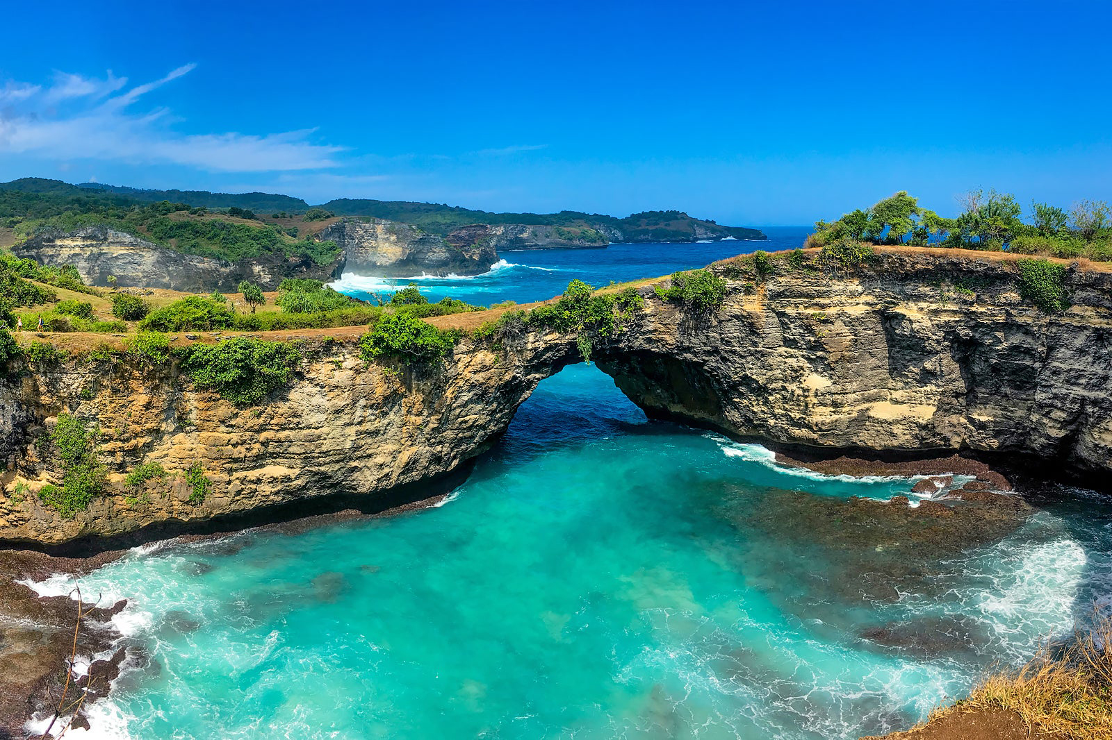 Nusa Penida is a beautiful island located off the southeastern coast of Bali. This hidden gem is the largest of the three Nusa Islands, which also include Nusa Lembongan and Nusa Ceningan. Nusa Penida has become increasingly popular over the past few years due to its stunning landscapes, crystal-clear waters, and untouched natural beauty.
